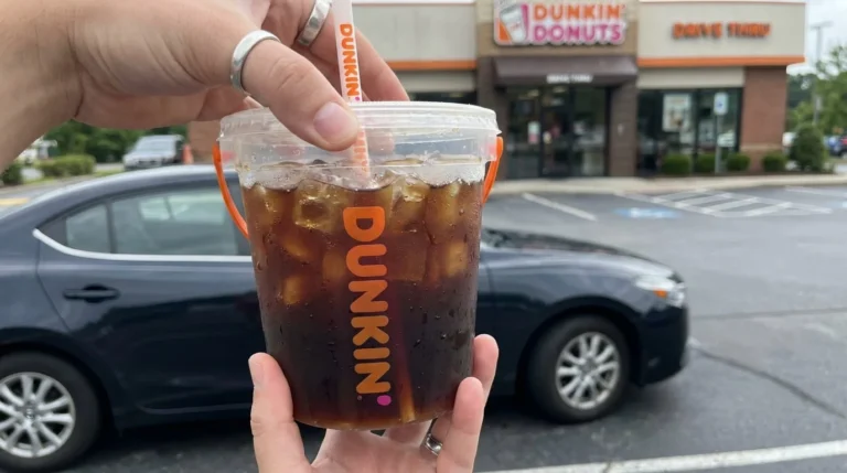 Dunkin Iced Beverage Bucket 48 oz iced coffee held outside a car