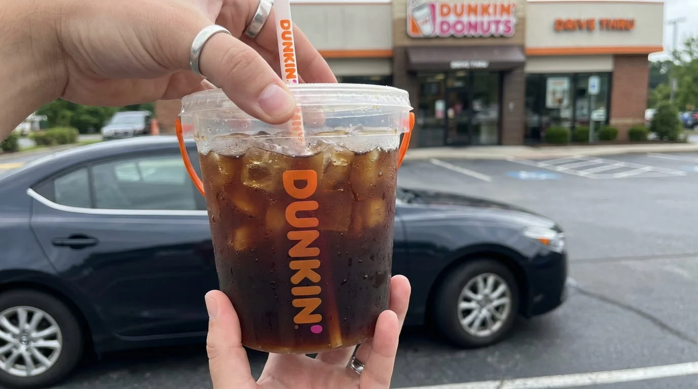 Dunkin Iced Beverage Bucket 48 oz iced coffee held outside a car