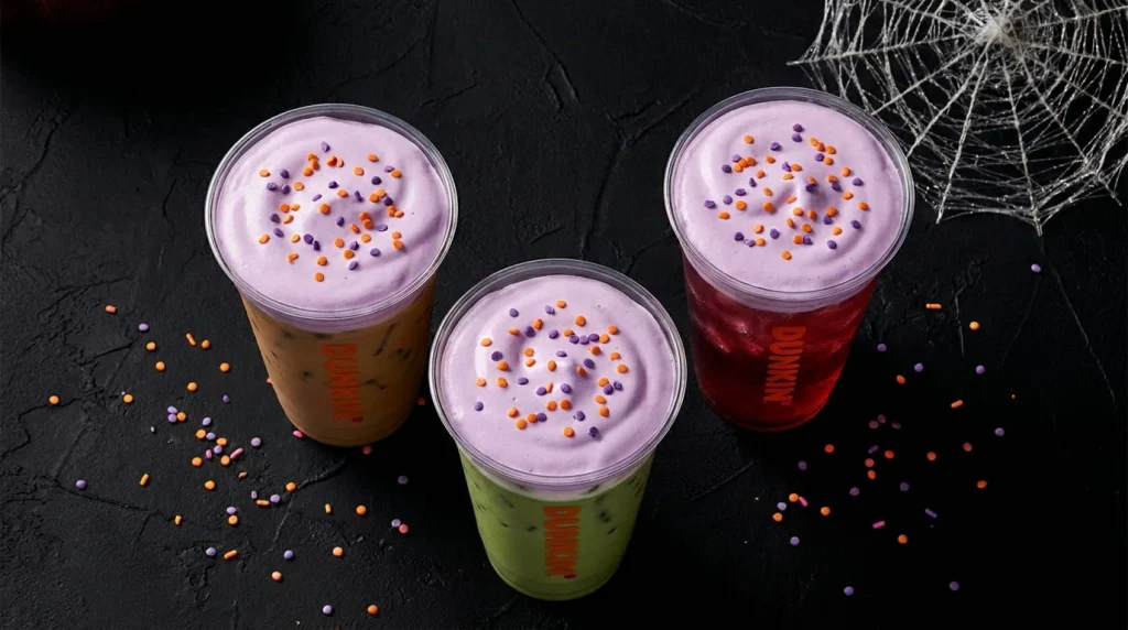 Iced drinks topped with purple cold foam for the Dunkin Halloween menu 2026