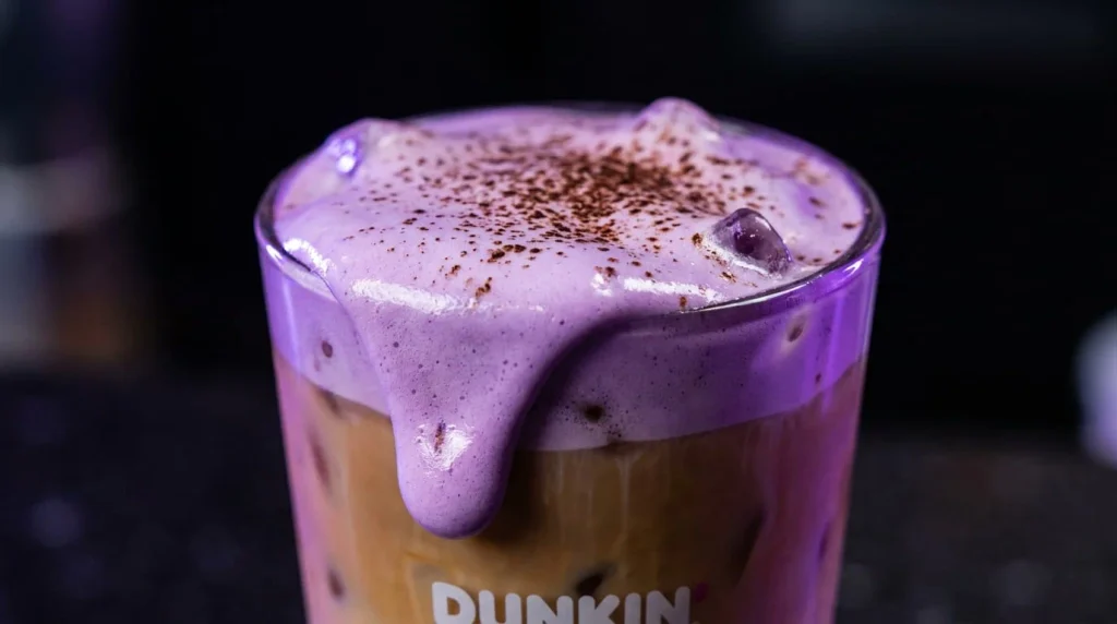Purple marshmallow cold foam on a Halloween iced latte