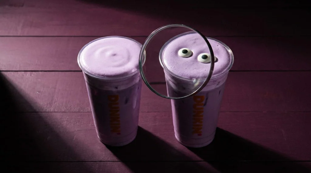 Two matching purple refreshers side by side, one with candy eyes, illustrating Berry Battie versus Dark Spell