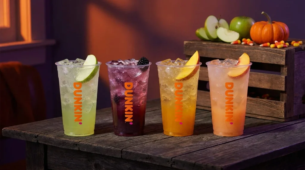 Four green apple Halloween energy drinks in green, purple, golden and peach tones